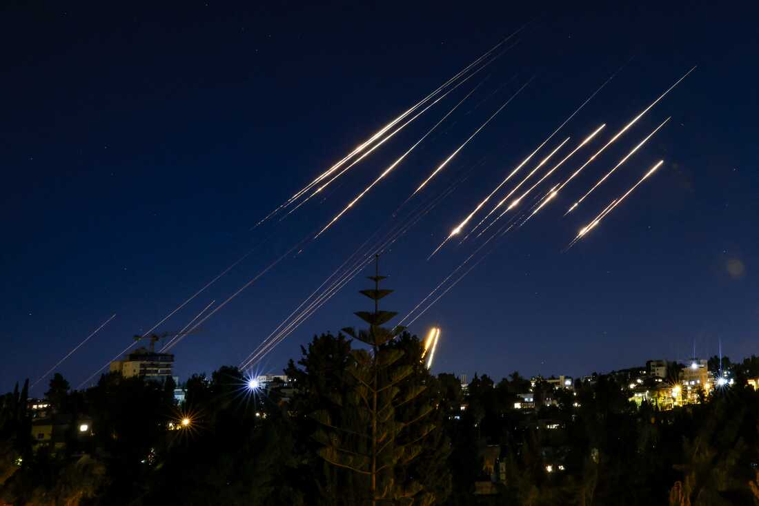 Missiles fired from Iran are pictured in the night sky over Jerusalem on June 14, 2025. Israel and Iran exchanged fire on June 14, a day after Israel unleashed an unprecedented aerial bombing campaign that Iran said hit its nuclear facilities, "martyred" top commanders and killed dozens of civilians (Photo by Menahem Kahana / AFP)