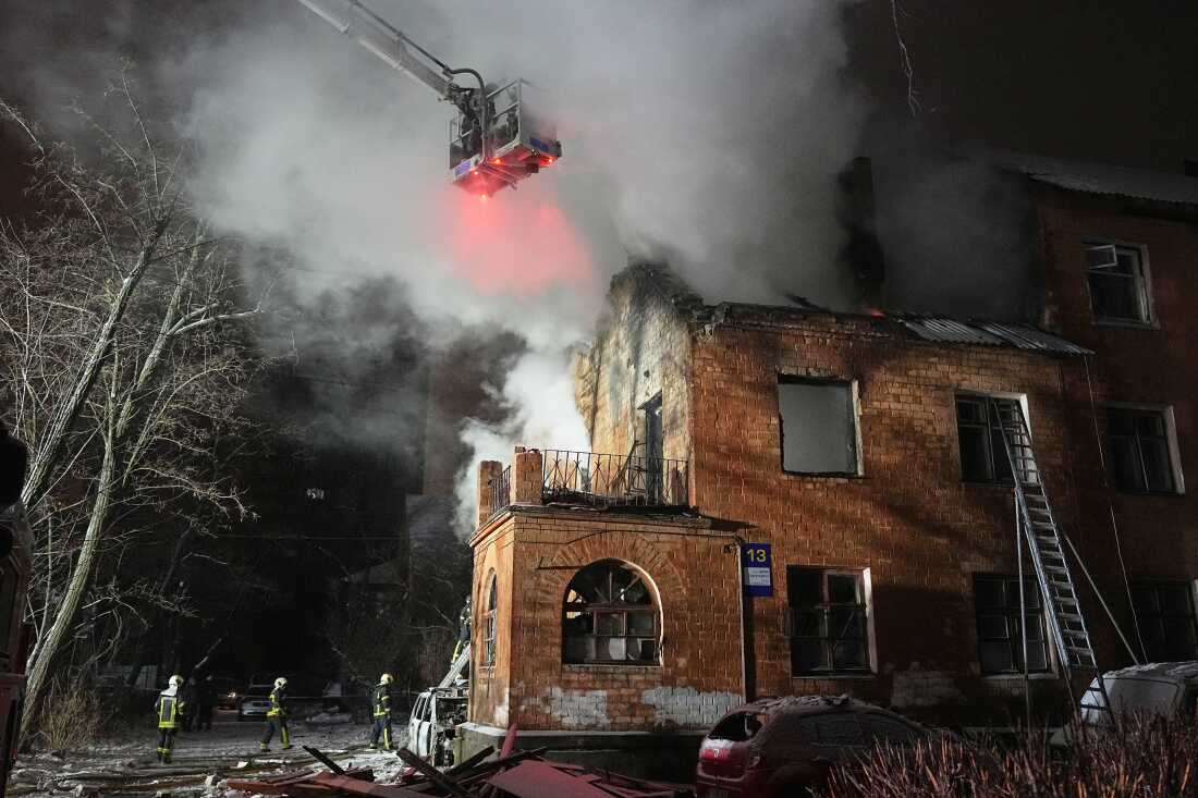 Rescue workers put out a fire at a residential building damaged by a Russian strike in Kyiv, Ukraine, Friday, Jan. 9, 2026. (AP Photo/Efrem Lukatsky)