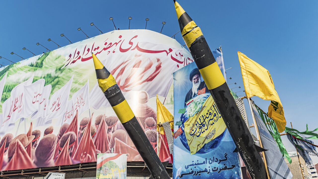 A pickup truck is carrying two Iranian missile mockups during a rally that marks the 46th anniversary of Iran’s 1979 Islamic Revolution in Tehran, Iran, on February 10, 2025. (Photo by Hossein Beris / Middle East Images / Middle East Images via AFP)