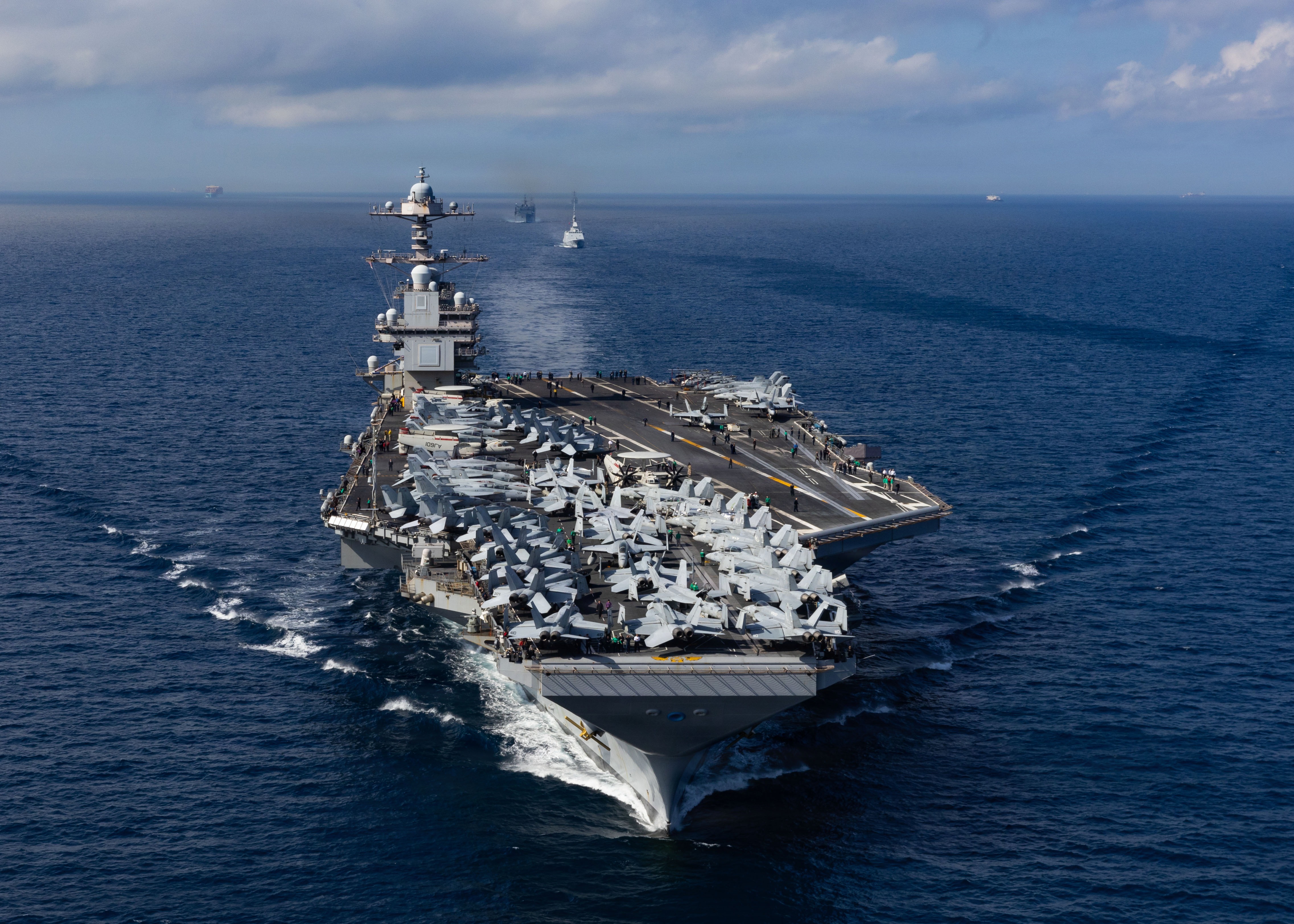 From front to back, the world’s largest aircraft carrier, USS Gerald R. Ford (CVN 78), Royal Moroccan Navy FREMM multipurpose frigate Mohammed VI (701), and Military Sealift Command fast combat support ship USNS Supply (T-AOE 6), steam in formation while transiting the Strait of Gibraltar, Oct. 1, 2025. Gerald R. Ford, a first-in-class aircraft carrier and deployed flagship of Carrier Strike Group Twelve, is on a scheduled deployment in the U.S. 6th Fleet area of operations to support the warfighting effectiveness, lethality and readiness of U.S. Naval Forces Europe-Africa, and defend U.S., Allied and partner interests in the region. (U.S. Navy photo by Mass Communication Specialist Seaman Apprentice Alyssa Joy)