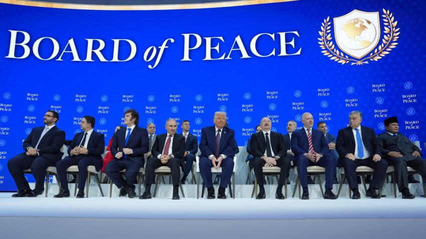 President Donald Trump, center, poses with international leaders after the signing of a Board of Peace charter during the Annual Meeting of the World Economic Forum in Davos, Switzerland, Thursday, Jan. 22, 2026. (AP Photo/Evan Vucci)