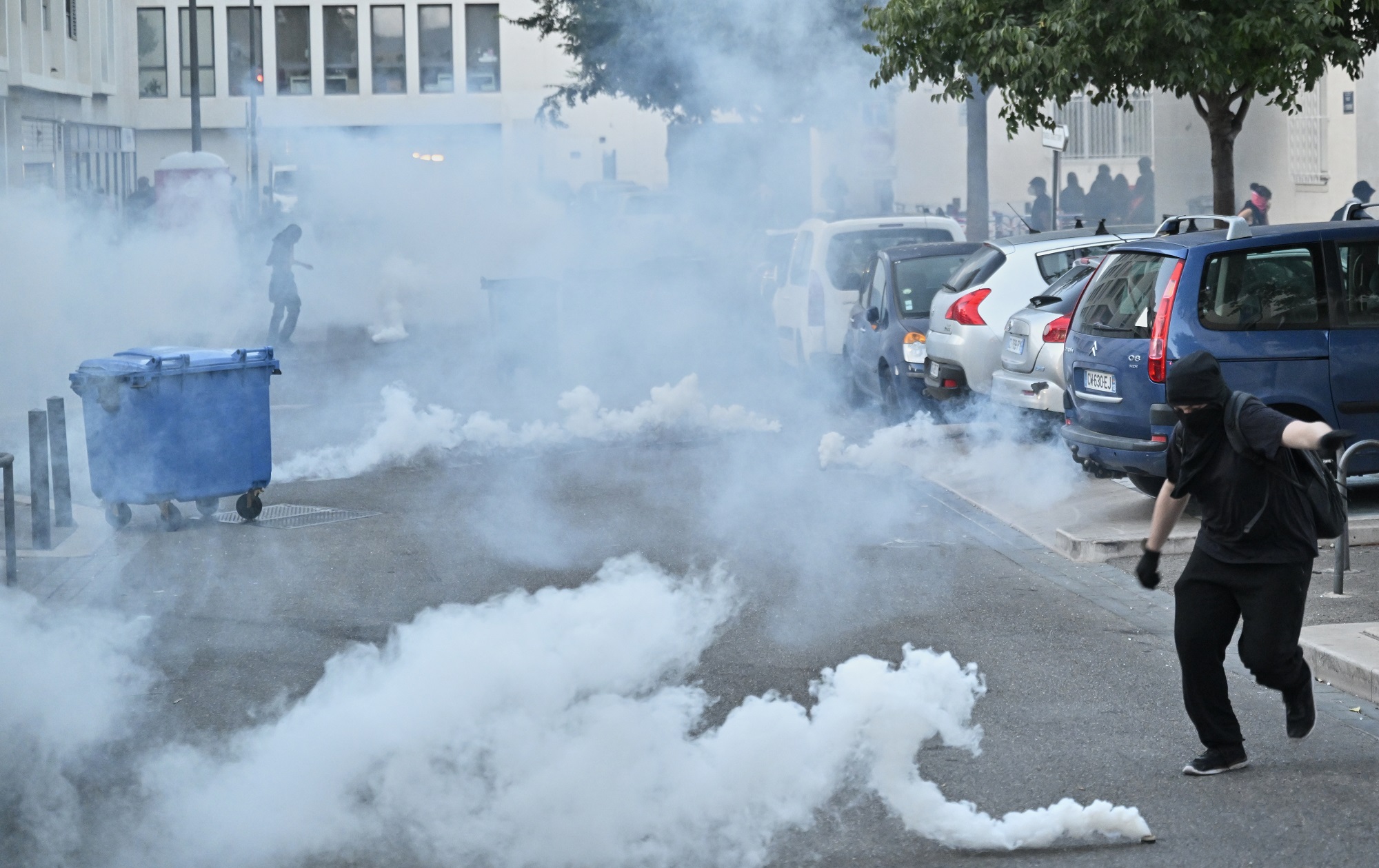 French police fire tear gas grenades on protesters during a gathering of the "Block Everything" movement in Marseille, south of France, Wednesday, Sept. 10, 2025. (AP Photo/Philippe Magoni)