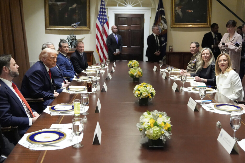 President Donald Trump and Italy's Prime Minister Giorgia Meloni are seated before lunch in the Cabinet Room of the White House, Thursday, April 17, 2025, in Washington. (AP Photo/Alex Brandon)
