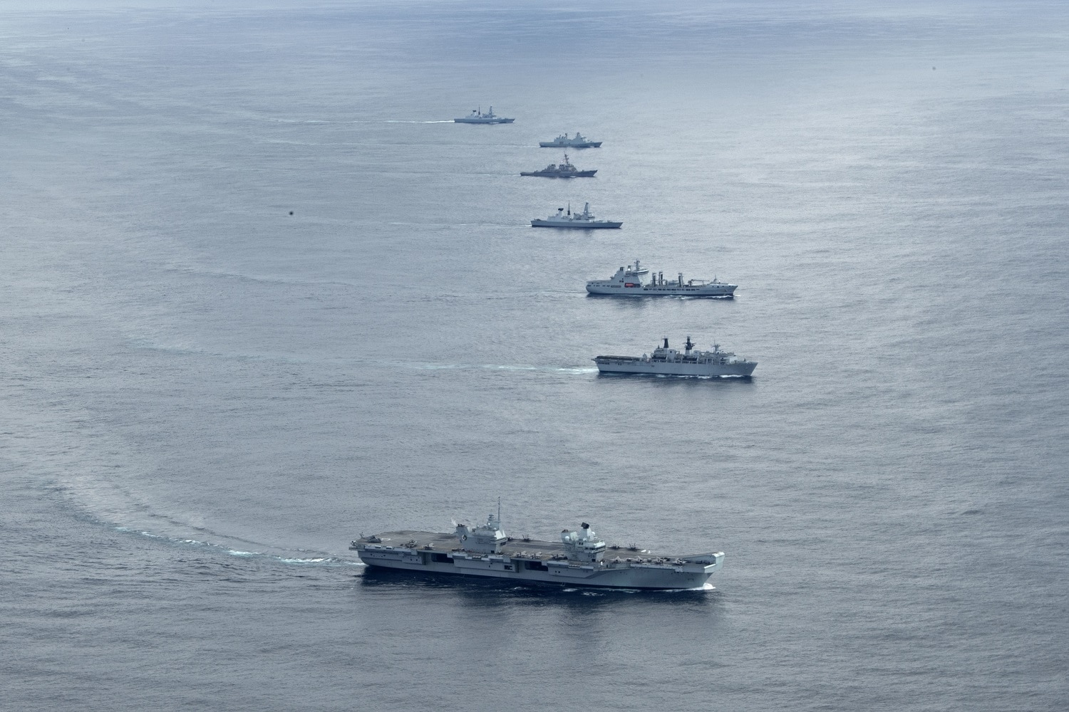 210517-N-WP865-2239ATLANTIC OCEAN (May 17, 2021) Ships from the U.S. Navy’s Iwo Jima Amphibious Ready Group (IWOARG), the Royal Navy’s Queen Elizabeth Carrier Strike Group and the French and Norwegian navies transit the Atlantic Ocean in formation during a photo exercise, May 17, 2021. The Wasp-class amphibious assault ship USS Iwo Jima (LHD 7) is the flagship of the IWOARG. Iwo Jima is underway in the Atlantic Ocean with Amphibious Squadron 4 and the 24th Marine Expeditionary Unit (MEU) as part of the Iwo Jima Amphibious Ready Group. (U.S. Navy photo by Mass Communication Specialist 2nd Class Brenton Poyser)