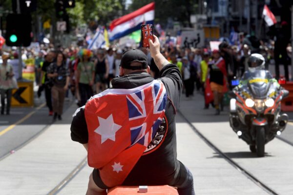 A protester attends a rally against new pandemic laws and vaccination mandates in Melbourne on December 4, 2021. (Photo by William WEST / AFP) (Photo by WILLIAM WEST/AFP via Getty Images)